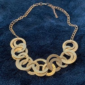 Gold style statement necklace.